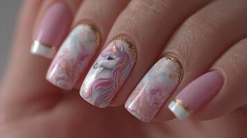 Beautifully designed unicorn nail art featuring pink and gold accents in a close-up view photo