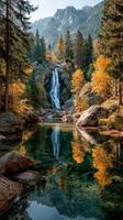 Breathtaking autumn landscape with a tranquil waterfall and colorful foliage in a serene forest setting photo