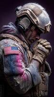 Soldier in tactical gear praying with dust and snow on uniform at a somber moment in an intense environment photo