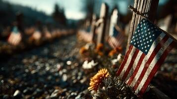 Flags and flowers commemorate heroes at a cemetery in autumn light photo