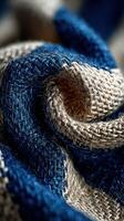 Textile composition featuring a blend of blue and beige fibers intertwined in a striking pattern photo