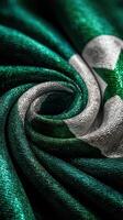 Satin fabric featuring green and silver colors with star design represents national pride and identity photo