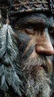 Portrait of a tribal warrior with painted face and feathers in a forest setting during daylight photo