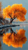 Vibrant orange tree reflecting on calm waters during autumn season at a serene lakeside photo