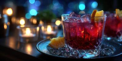 Refreshing cocktails with ice and citrus served on a decorative tray in a dimly lit bar setting photo
