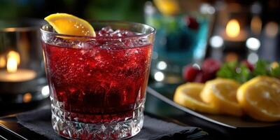 Refreshing cocktail with vibrant red hue garnished with lemon slices served in an elegant setting at a bar photo