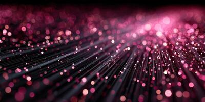 Beautiful pink glitter particles sparkle on a dark background, creating a stunning visual effect for an enchanting atmosphere photo