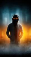 Mysterious figure in hoodie with headphones and sunglasses stands against a smoky, illuminated backdrop photo