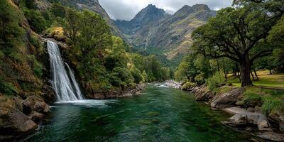Waterfall cascades into serene river surrounded by majestic mountains and lush greenery photo