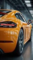 Bright orange sports car showcased in a modern indoor setting with sleek lines and design details photo