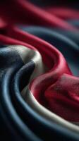Vibrant folds of a fabric featuring the colors of the national flag close-up at afternoon light photo
