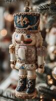 Decorative nutcracker ornament hanging on a holiday tree with warm lights in a cozy interior setting photo