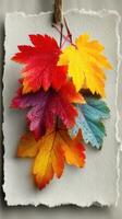 Brightly colored autumn leaves with dewy droplets hang against textured background showcasing seasonal beauty photo