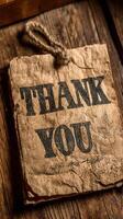 Rustic thank you card displayed on a wooden surface with natural lighting photo