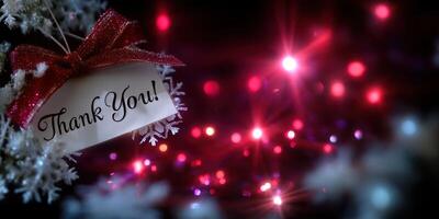 Festive thank you card decorated with a ribbon, displayed against colorful holiday lights during the winter season photo