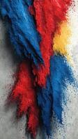 Colorful powdered pigments create a vibrant texture on a gray surface during an artistic project photo