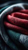 Close-up view of intricately folded fabric showcasing rich textures and bold colors in a cozy setting photo