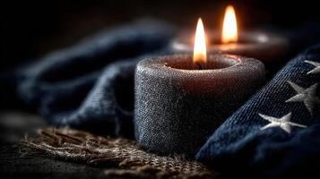 Candles illuminate a dark setting with textured fabric and star-embroidered design photo