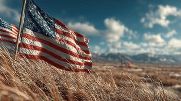 American flags waving gently in a field with mountains and clouds on a clear day photo