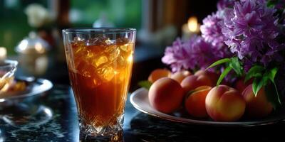 Refreshing iced tea served beside fresh peaches and lilacs in a cozy afternoon setting photo