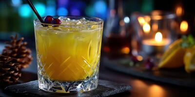 Refreshing citrus cocktail served on a bar counter with festive decorations during an evening gathering photo