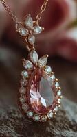 Exquisite rose gold necklace with pink gemstone and sparkling diamonds displayed on a textured surface photo