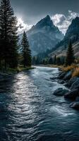 Tranquil river flows through mountain valley at sunset with towering peaks and dense trees photo