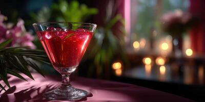 Refreshing cocktail garnished with mint on a summer evening with candles and flowers in the background photo