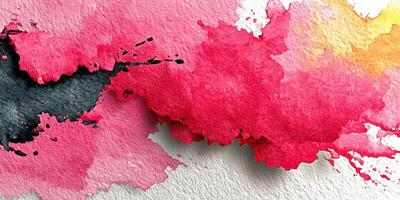 Abstract watercolor design featuring red, pink, and orange splashes on textured paper photo