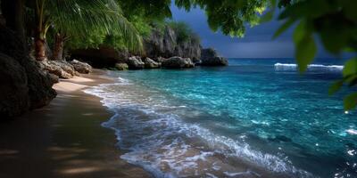 Tranquil beach with clear blue waters and lush greenery under a cloudy sky photo