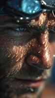 Close-up of an athlete's face with water droplets after an intense training session in a swimming pool setting photo