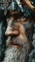 Portrait of a warrior with intricate face paint and fur headgear in a dramatic close-up during a traditional festival photo