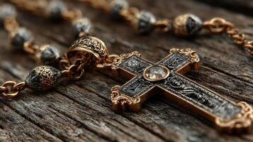 Intricate golden cross pendant rests on weathered wooden surface showcasing fine artistry and historical craftsmanship photo