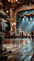 Cinematic camera ready to capture performance in an ornate theater with glowing lights and a lively atmosphere during an evening show photo