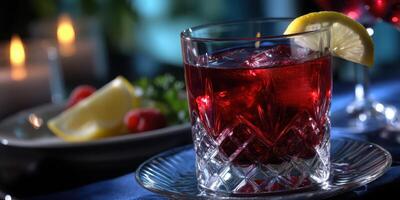 Refreshing beverage with ice and garnish in an elegant setting during evening dining photo