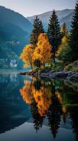 Vibrant autumn reflection on a tranquil lake surrounded by mountains and golden trees in late afternoon light photo
