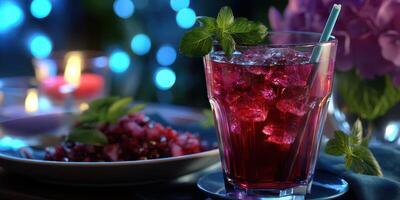 Refreshing cocktail with ice and mint served at an evening gathering amidst soft glowing lights photo