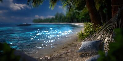 Relaxing hammock by the serene beach with turquoise water and lush palm trees under a clear blue sky photo