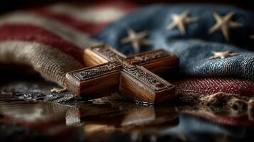 Cross resting on folded American flag representing faith and patriotism in a solemn setting photo