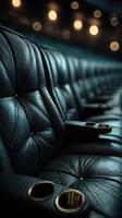 Luxurious black leather seating in a dimly lit theater perfect for an unforgettable cinematic experience photo