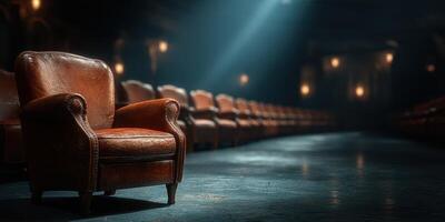 Empty leather armchair under dim lighting in a vintage theater setting creates an inviting atmosphere for a performance photo