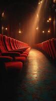 Luxurious red velvet theater in soft golden light creating an elegant ambiance during evening performance photo
