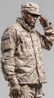 Saluting soldier in military uniform stands proudly against a neutral background photo