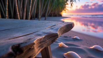 Wooden Bench on Beach with Seashells at Sunset Tranquil Scene photo