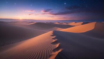 Sand Dunes at Night Illuminated by Starry Sky and Setting Sun photo