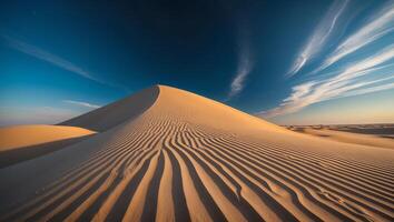 Sand Dune Landscape with Textured Ridges and Dramatic Blue Sky photo