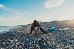 Man On The Seashore Preparing To Start Fishing photo