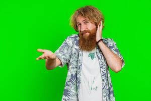 Confused man feeling embarrassed about question, having doubts, no answer, clueless, uncertain photo