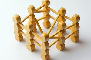 Interconnected wooden figures. A group of people connected by sticks, forming a lattice. A strong community concept, emphasized by the interwoven figures photo
