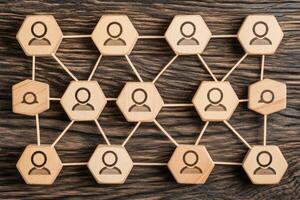 A wooden network with people icons photo